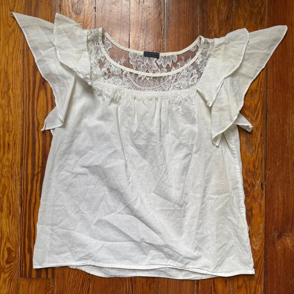 White lace blouse with ruffles